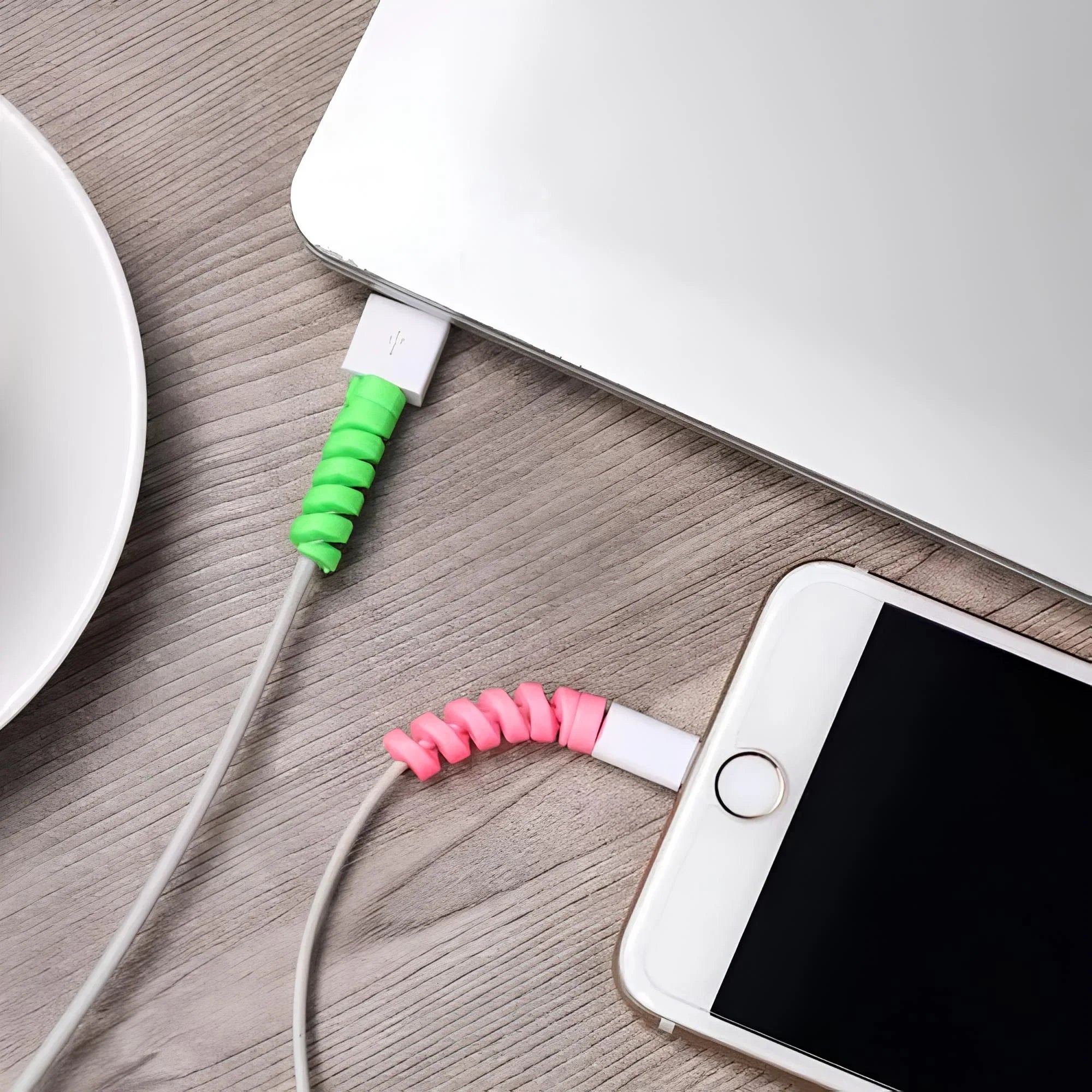 CaseKaro Spiral Cable Protectors fitted to cables on a desk